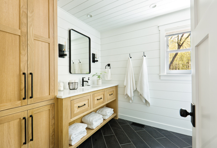 a bathroom with white tiles